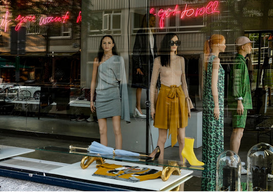 displayed women's dress on glass