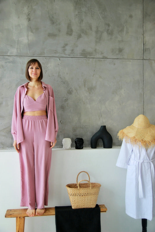 a woman standing in front of a wall